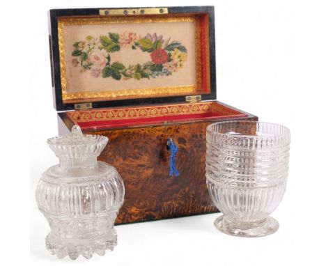 A 19th century amboyna tea caddy, having a handled rising lid, fitted glass mixing bowl and jar and cover, W24cmThe 2 glass b