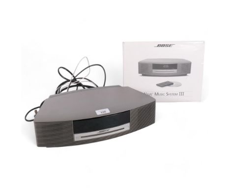 A Bose Wave Music System III, radio, CD player, with remote control, associated cables and instruction manual