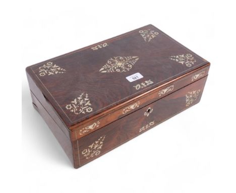 A mahogany writing slope with inlaid mother-of-pearl motifs, fitted interior, and contents including a pair of brass lidded i