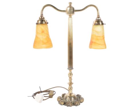An Art Nouveau style brass twin-arm table lamp, with orange and yellow marbled glass shades, H56.5cm