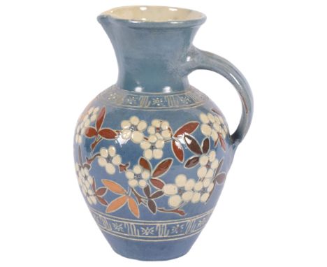 An Antique Art pottery jug by C H Brannam, marked Barum 1888, monogram JD, with floral decoration, H22cm