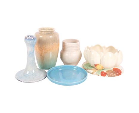 A Clarice Cliff lobed bowl on base decorated with flowers, L21cm, and a Clarice Cliff beige ribbed vase, a Ruskin vase with l