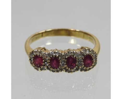 An 18 carat gold ruby and diamond cluster ring