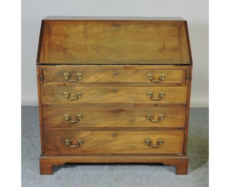 A George III mahogany bureau, with four graduated drawers, on bracket feet, 102cm