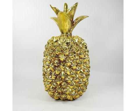 A large gilt painted model of a pineapple, 50cm high