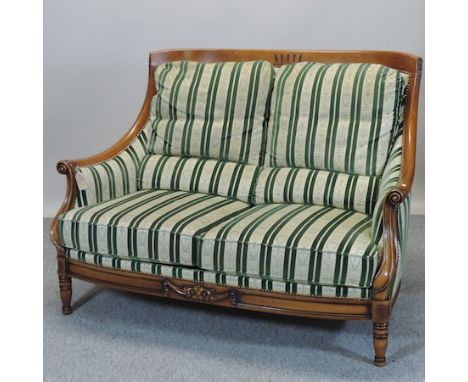 An Edwardian style green upholstered show frame sofa, 137cm