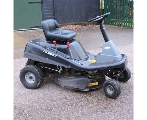 A Murray ride-on petrol driven lawn mower, with manual