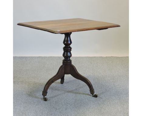 A 19th century oak side table, with a tilt top, on a tripod base, 82cm