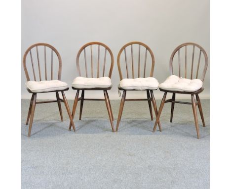 A set of four Ercol dark elm dining chairs