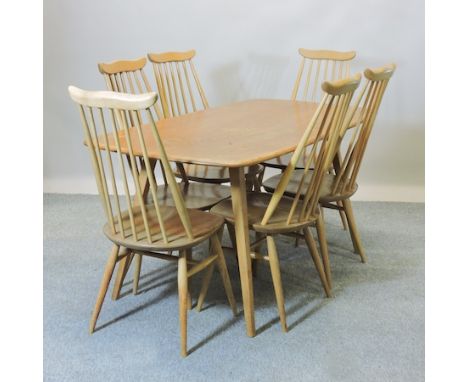 An Ercol light elm dining table, 153 x 77cm, together with a set of six dining chairs