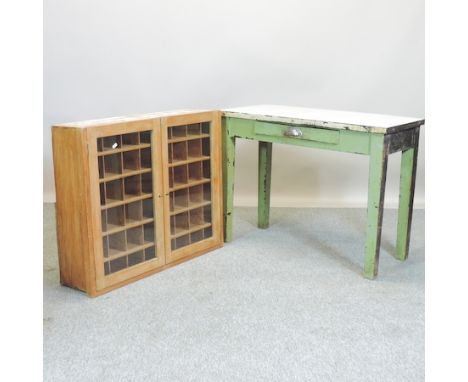 A glazed pine hanging cabinet, 95cm, together with a green painted table, with an enamel top