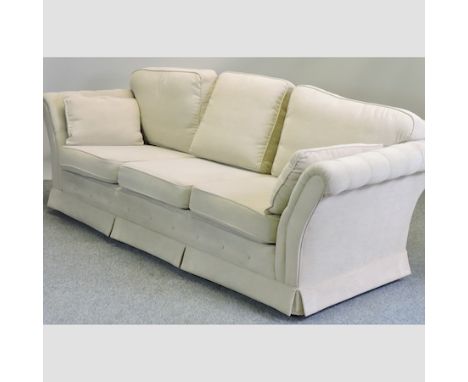 A modern cream upholstered three seater sofa, 244cm