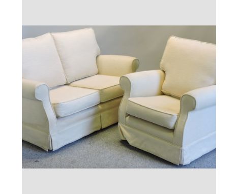 A modern cream upholstered two seater sofa, 146cm, together with a matching armchair