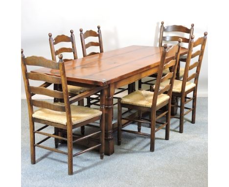 An 18th century style oak refectory table, 193 x 83cm, together with six rush seated ladder back dining chairs, to include tw