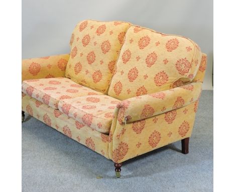 A gold and red upholstered two seater sofa, 190cm