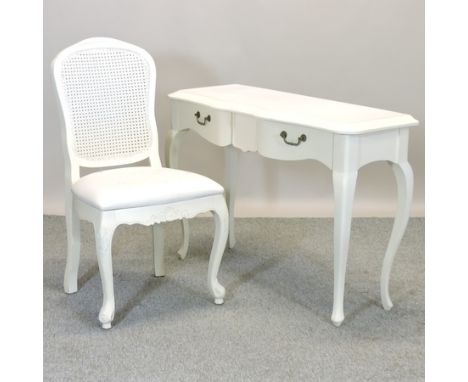 A white painted console table, 110cm, together with a cane back side chair