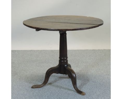 A 19th century oak occasional table, on a tripod base, 86cm