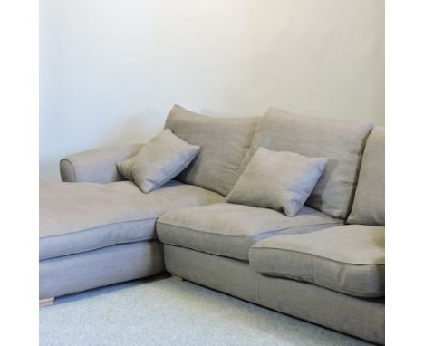 A modern light brown upholstered corner sofa, 306cm