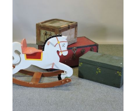 A red vintage metal bound travelling trunk, 92cm, together with two others and a painted wooden rocking horse, 95cm long