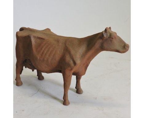 A rusted metal model of a cow, 36cm