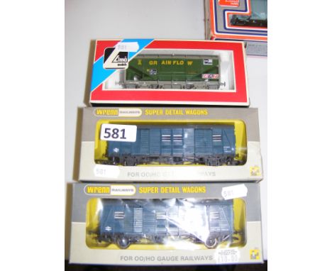 A pair of Wrenn W4324 Utility Van Blue Freight Rolling Stock and a Lima example.