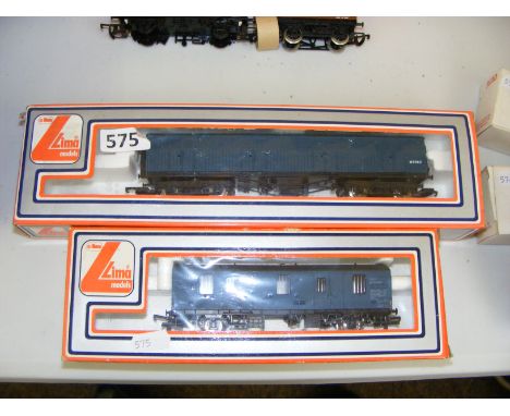 Two boxed Lima wagons.