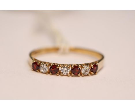 Ladies 9ct Gold CZ and Ruby Set ring Size P. 1.2g total weight 
