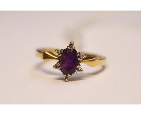 Ladies 18ct Oval Amethyst and Diamond set ring Size L. 3.5g total weight 