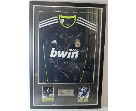 Real Madrid 2010-11 Framed Shirt Signed by the Squad. Signatures on an ADIDAS Real Madrid 2010-11 framed and glazed away shir