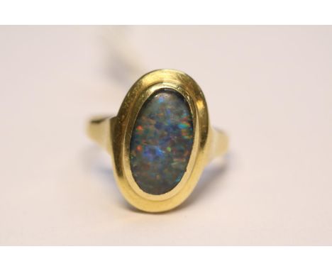Ladies 18ct Gold Oval Opal rub over set ring Size O. 4.7g total weight 
