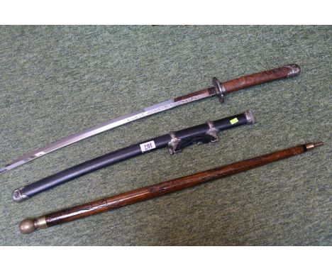Reproduction Samurai Sword in scabbard and a Carved wooden stick with brass ferrule 