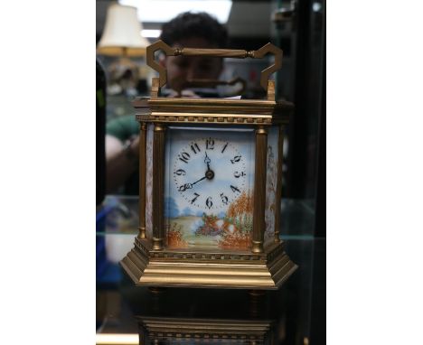 Late 19thC French Carriage clock with hand painted ceramic panels of 6 sides, numeral dial and brass case complete with key 1