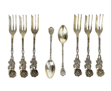 A set of six 835 silver cake forks with rose cast handles. Stamped 835; together with a pair of Mappin &amp; Webb silver teas