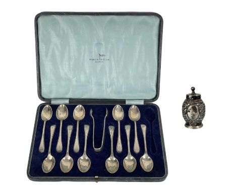 A George V silver teaspoon set for eleven (one spoon missing) within fitted box by Walker & Hall. Old English beaded pattern,