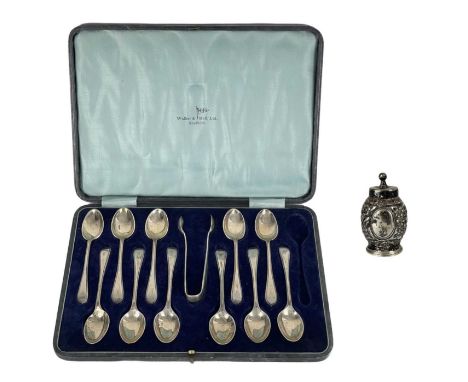 A George V silver teaspoon set for eleven (one spoon missing) within fitted box by Walker & Hall. Old English beaded pattern,