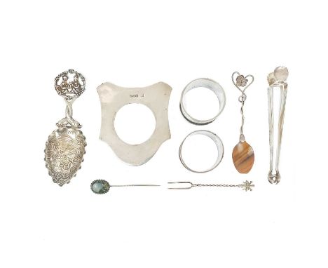 A collection of silver items.  To include a German embossed caddy spoon by Theodore Hartmann, London import hallmarks for 190