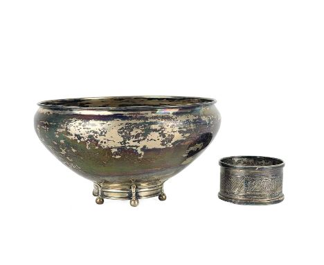 A silver bowl by maker W.B.  The bowl raised on six ball feet, width 12cm, height 6.5cm; Toghether with a napkin ring by Henr