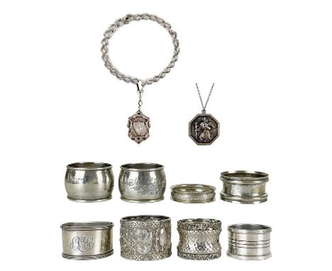 A selection of six silver napkin rings, a shield fob, curb chain and a pendant necklace. One napkin ring is Victorian by Mapp