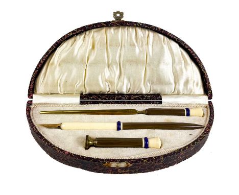 An Art Deco celluloid pen set. In fitted case, including a fountain pen, a letter opener and a blank seal stamp.