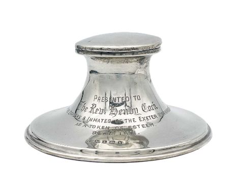 An Edwardian silver capstan inkwell. With engraved dedication, weighted base, Birmingham 1909, height 5.5cm.