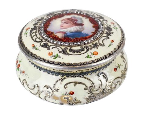 A Continental silver gilt and enamel diamond set pill box. The hinge lid portrait painted with a young lady, bordered with re