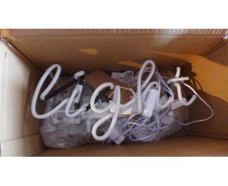 A pair of neon signs, 'Light' 
