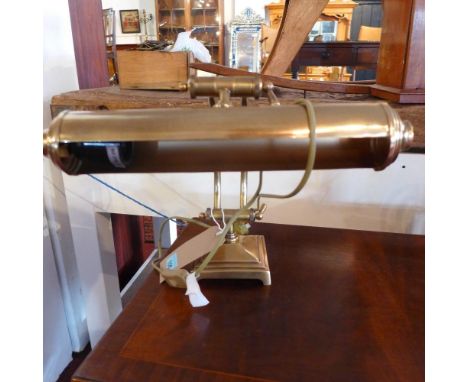 A contemporary brass bankers lamp 