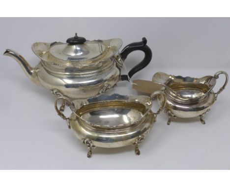 A late 19th century silver tea service comprising of a teapot a sugar sifter and a sauce boat, hallmarked London, maker Sibra