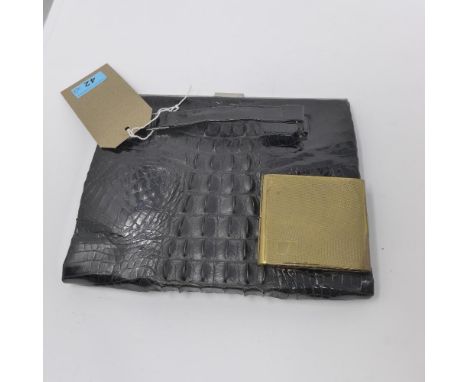 A crocodile skin handbag with snake skin interior, together with a compact 