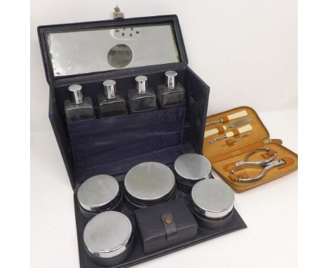 A travelling vanity set with engine turned lids, together with a manicure set 