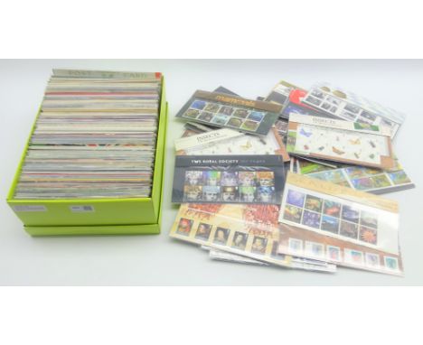 Approximately 320 GBP face value of unused postage, mostly in presentation pack with many first class stamps and higher value