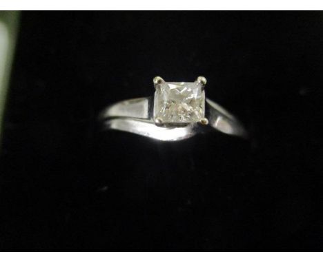 A 9ct white gold diamond ring on a scrolled shank 