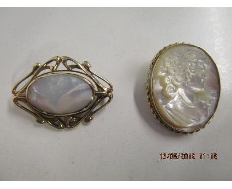 An oval carved mother of pearl brooch depicting a Dexter profile of a young lady in a 9ct yellow gold setting and an Art nouv