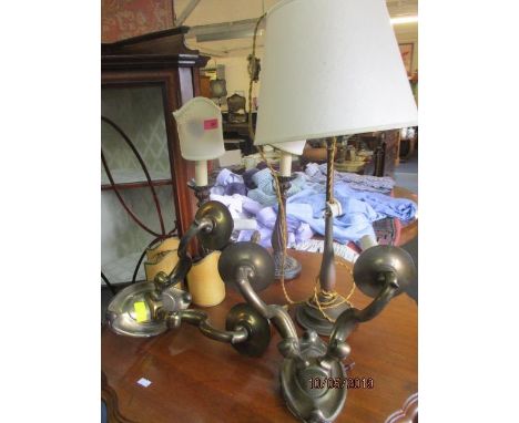 A pair of early 20th century brass wall lights, a table lamp and a pair of mid 20th century treen table lamps 